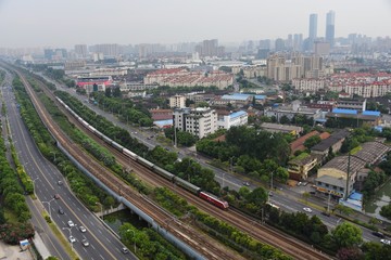 Obraz premium A train is about to enter Wuxi railway station on the busy Beijing Shanghai line