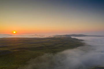 Fototapeta na wymiar Sunrise above Gordale Scar, Malham, in the Yorkshire Dales National Park