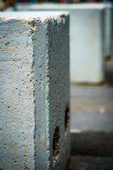 A close view of the texture on concrete blocks used as anti terrorism bollards in populated areas in large cities