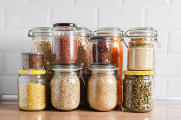 Dry legumes, grains, and seeds in glass jars. Zero waste storage