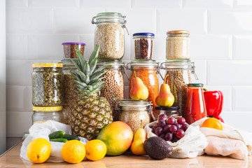 Fruits, vegetables, legumes, grains, seeds on a kitchen counter. Zero waste storage