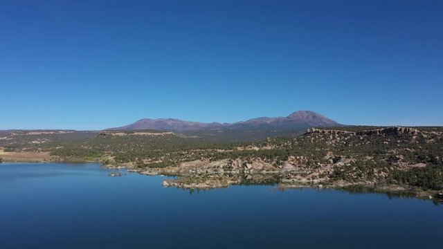 Aerial view of Recapture Reservoir in Utah state. Blue lake and mountains. USA country
