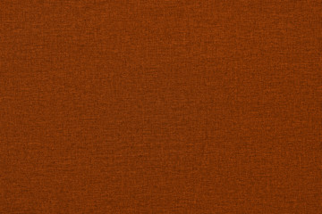 Orange background with a textured surface, fabric.