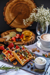 Breakfast with waffles and coffee.
