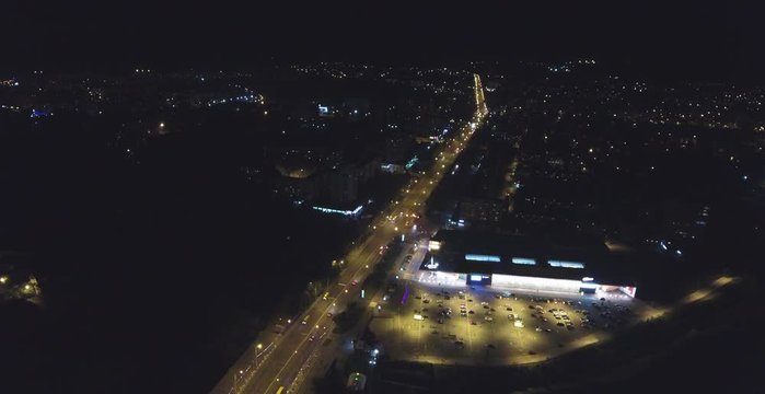 Aerial video of a night center Sumy city with car traffic 