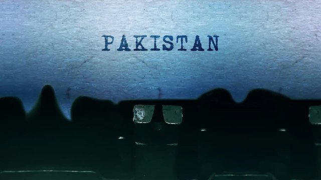 PAKISTAN Word closeup Being Typing and Centered on a Sheet of paper on old vintage Typewriter mechanical 4k Footage Background Animation.