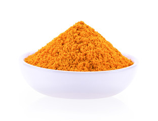 Turmeric powder in a separate ceramic cup  on a white background.