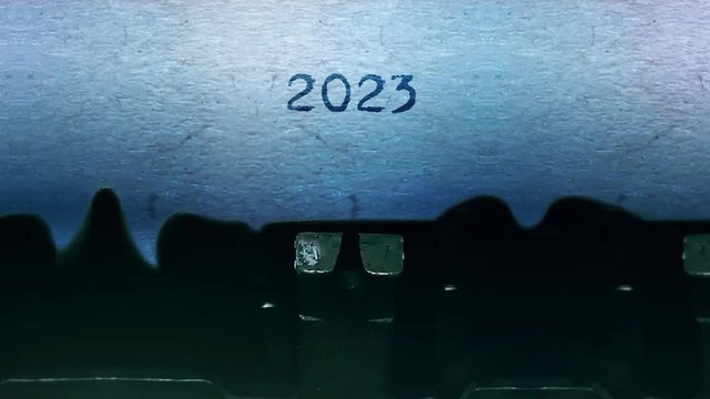 2023 New Year Word closeup Being Typing and Centered on a Sheet of paper on old vintage Typewriter mechanical 4k Footage Background Animation.
