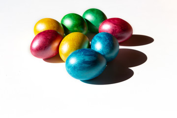 Colorful easter eggs on white background. Happy Easter composition. Copy space.