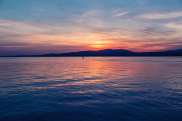 SAP surfing at sunset in Gelendzhik, Krasnodar region, Russia.