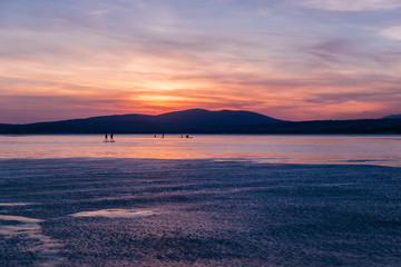 SAP surfing at sunset in Gelendzhik, Krasnodar region.