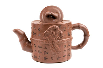 Traditional Japanese clay teapot. Japanese characters on a teapot translated into English mean "health", "longevity", "wisdom"