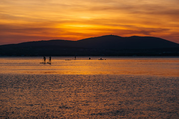 SAP surfing at sunset in Gelendzhik, Krasnodar region.