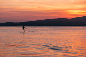 SAP surfing at sunset in Gelendzhik, Krasnodar region.