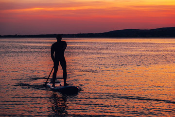 SAP surfing at sunset in Gelendzhik, Krasnodar region.