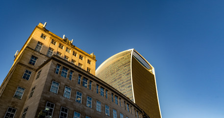 Modern building skyline highlighted with a low evening orange sun