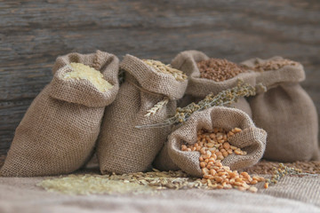 Cereals in bags close-up. 5 varieties of cereals, rice, oats, peas, wheat, buckwheat.