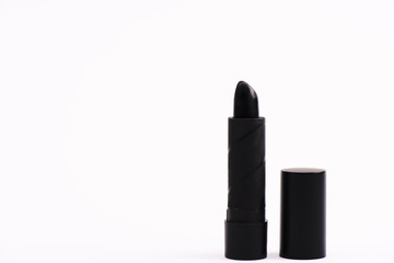 Obraz premium black lipstick on white with copy space