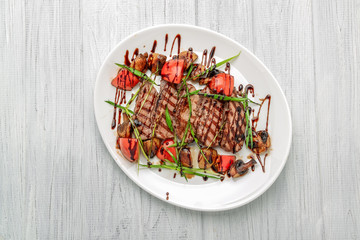 Grilled beef steak with mushrooms and tomatoes. Concept for healthy nutrition.