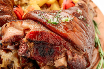 Roaster Pork Knuckle with savoy cabbage and baked potatoes