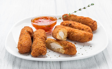 Fried chicken nuggets with ketchup on a plate