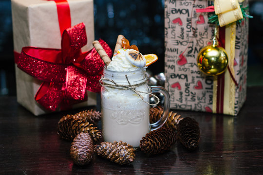 milkshake with marshmallows, waffle tubes and gifts
