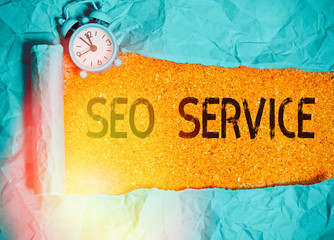 Handwriting text writing Seo Service. Conceptual photo techniques and procedures to increase the...