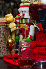 red drink, candle and gifts