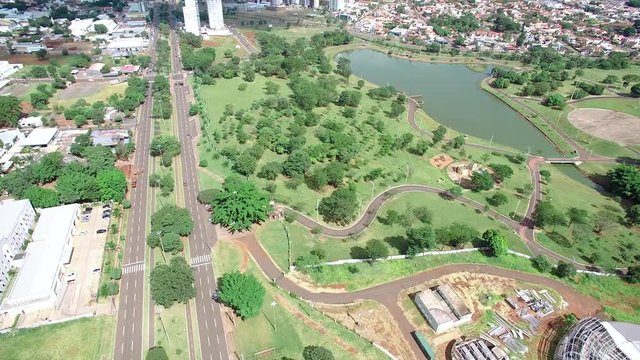 Aerial view of the city of Campo Grande MS, Brazil. Video at the highs of Afonso Pena avenue and the park. Low density growing city, wooded and with a large avenue.