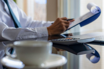 Businessman checking business data chart.