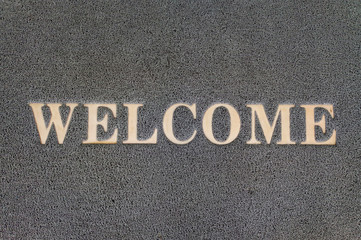Overhead view of welcome mat outside