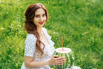 Fototapeta premium Woman with watermelon on grass.