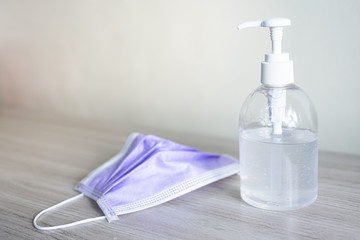 Hand sanitizer gel bottle or soap for coronavirus prevention, hygiene to stop spreading covid-19 (select focus)