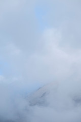 Fototapeta na wymiar Clouds cover the top of a mountain near Assergi, Italy
