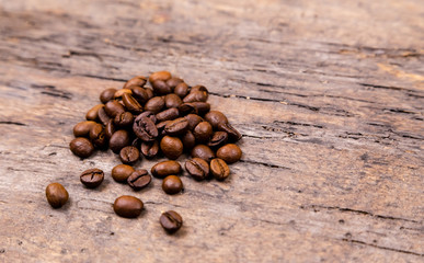 Aromatic coffee beans on white wooden table. Top view. Banner