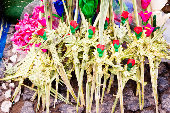 Religious Easter decorations with red and green colors made with leaves, in Taxco