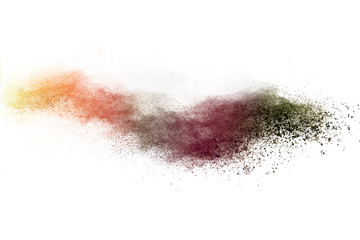 Freeze motion of brown color powder exploding on white background. 