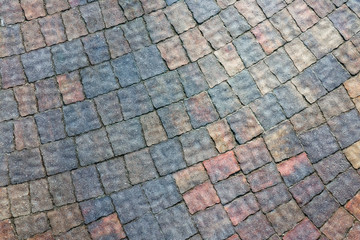masonry wall paving stones as a background close up