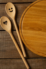 round cutting board and smiling spoon