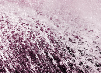 Strong wave with foam and ripple splash water texture in a summer sea, ocean or river.