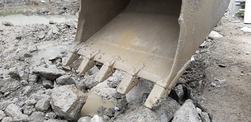 excavator with loading shovel on construction site