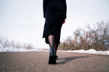 woman walking on the road