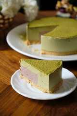 Greentea Matcha Mousse cake.  set on cafe table.