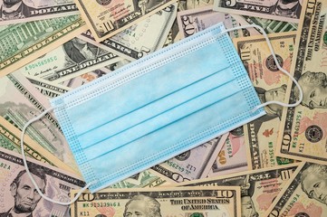 Medical viel laid on US dollars.