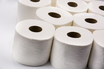 Full toilet paper rolls isolated on white background