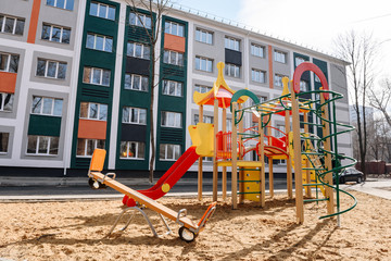 Fototapeta na wymiar an empty playground in the courtyard of a residential building.