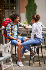 Guy with backpack talking with girl