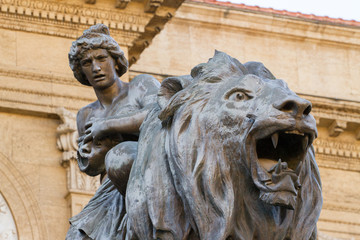 statues located at the entrance of the Massimo theater