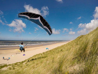 extreme paragliding soaring in Netherlands dunes beach