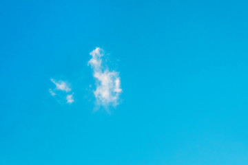 Lonely cloud on blue sky background